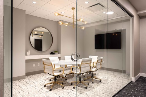 a meeting room with a table and chairs at 220 Meridian, Indianapolis, IN 46204